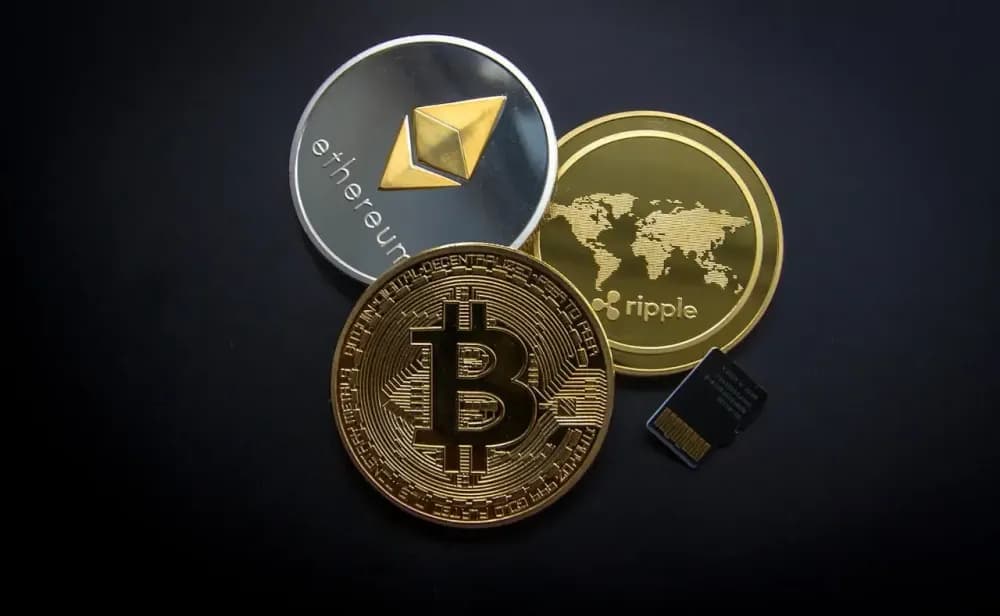 Bitcoin, Ethereum and cryptocurrency coins on dark background — crypto exchange guide