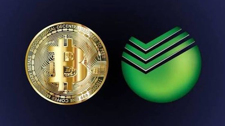 Bitcoin coin next to the Sber logo